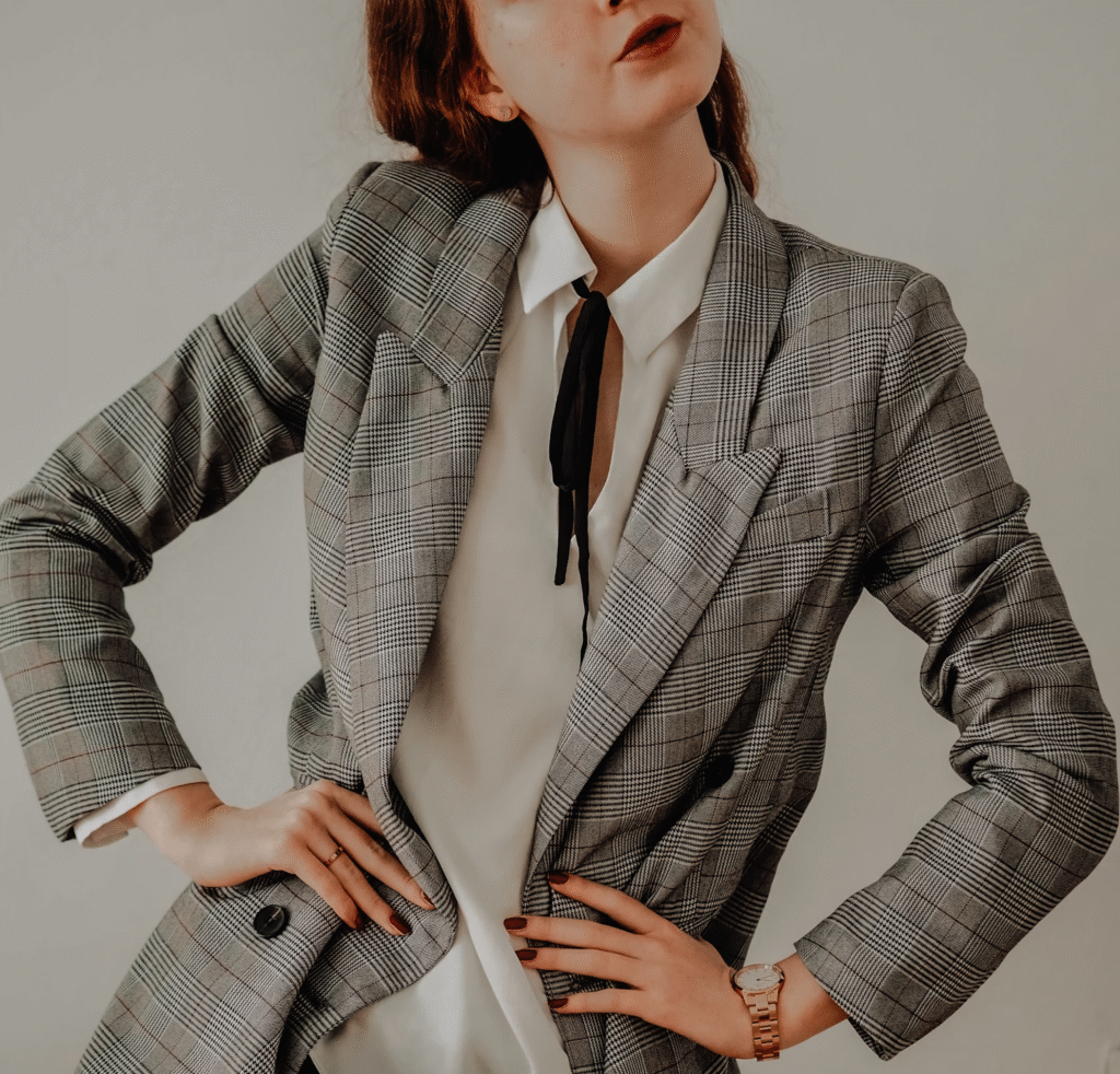 woman posing with a tailored suit